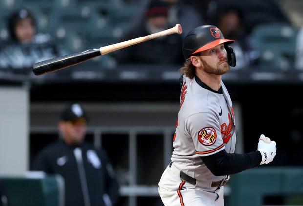 Baltimore Orioles left fielder Taylor Ward lets go of his bat on a run-scoring double in the eighth inning of a game against the Chicago White Sox at Rate Field in Chicago on April 7, 2026. (Chris Sweda/Chicago Tribune)
