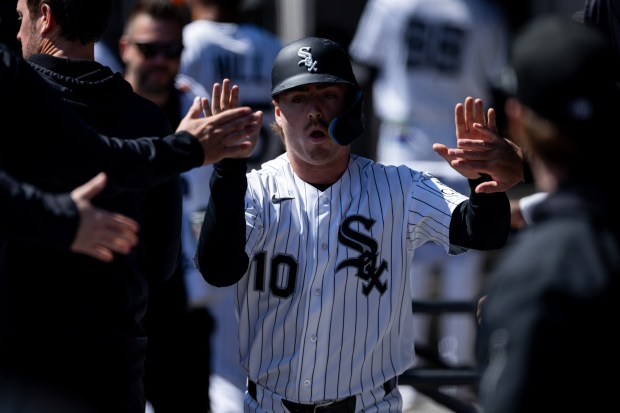 Chicago White Sox shortstop Chase Meidroth (10) celebrates in the dugout after scoring a run during the first inning of a game against the Toronto Blue Jays at Rate Field on Sunday, April 5, 2026. (Josh Boland/Chicago Tribune)