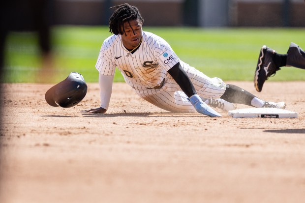 Chicago White Sox second baseman Luisangel Acuña (0) slides safe into second base during the second inning of a game against the Toronto Blue Jays at Rate Field on Sunday, April 5, 2026. (Josh Boland/Chicago Tribune)