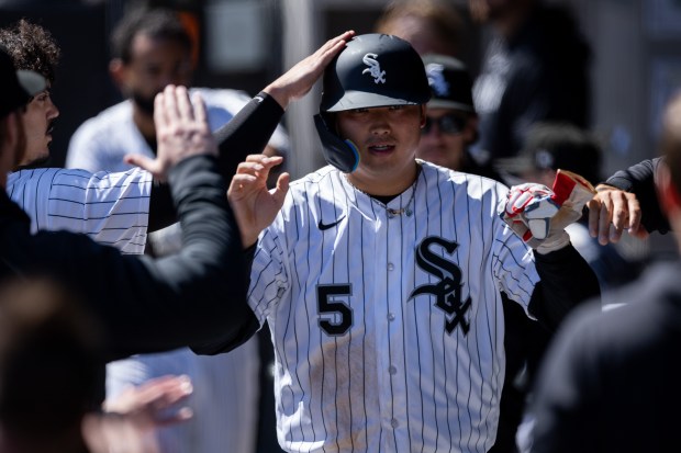 Chicago White Sox first baseman Munetaka Murakami (5) celebrates in the dugout after scoring a run during the third inning of a game against the Toronto Blue Jays at Rate Field on Sunday, April 5, 2026. (Josh Boland/Chicago Tribune)