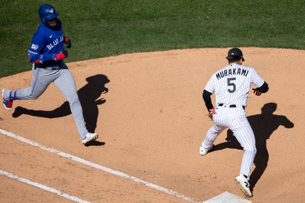 Chicago White Sox first baseman Munetaka Murakami (5) tags first base getting Toronto Blue Jays right fielder Jesús Sánchez (12) out during the eighth inning of a game at Rate Field on Sunday, April 5, 2026. (Josh Boland/Chicago Tribune)