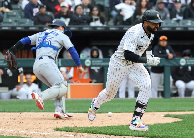 White Sox outfielder Derek Hill darts to first base on a bunt in the tenth inning against the Blue Jays at Rate Field on April 3, 2026, in Chicago. (John J. Kim/Chicago Tribune)