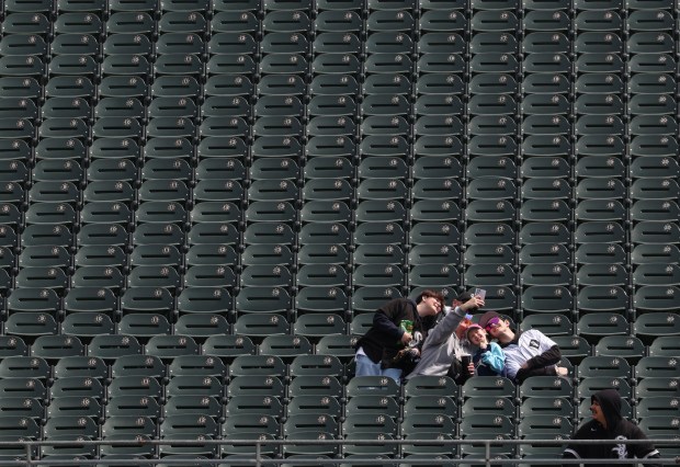 A group of White Sox fans take pictures before a White Sox-Orioles game at Rate Field on April 8, 2026, in Chicago. (John J. Kim/Chicago Tribune)