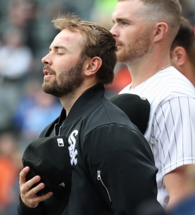 White Sox pitcher Tyler Schweitzer takes in the breeze while standing for the national anthem before a game against the Orioles at Rate Field on April 8, 2026, in Chicago. (John J. Kim/Chicago Tribune)