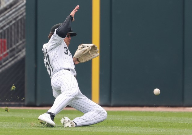 White Sox right fielder Dustin Harris chases down a ball hit for a single from Orioles left fielder Taylor Ward in the first inning at Rate Field on April 8, 2026, in Chicago. (John J. Kim/Chicago Tribune)
