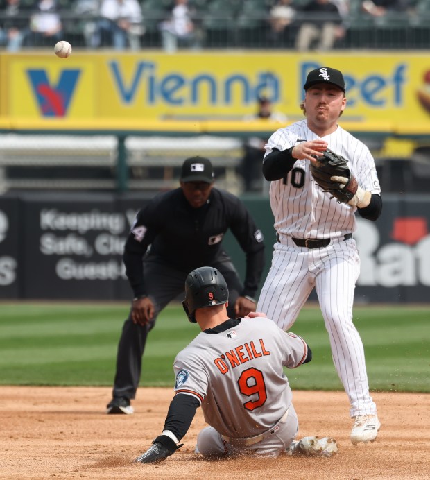 White Sox second baseman Chase Meidroth (10) attempts an unsuccessful double play after forcing out Orioles right fielder Tyler O'Neill in the second inning at Rate Field on April 8, 2026, in Chicago. (John J. Kim/Chicago Tribune)