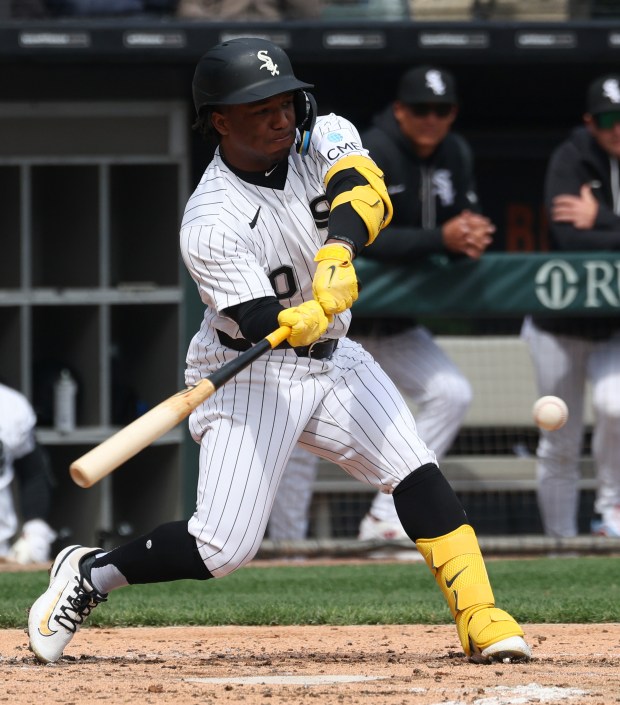 White Sox shortstop Luisangel Acuña swings for an RBI single against the Orioles in the second inning at Rate Field on April 8, 2026, in Chicago. (John J. Kim/Chicago Tribune)