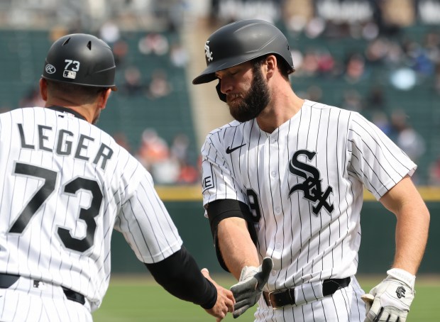 White Sox center fielder Tristan Peters, right, is congratulated after hitting a single against the Orioles in the second inning at Rate Field on April 8, 2026, in Chicago. (John J. Kim/Chicago Tribune)