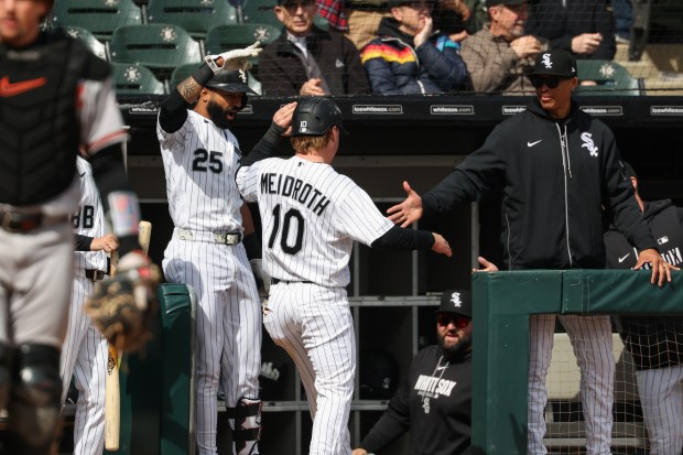 White Sox second baseman Chase Meidroth is congratulated after scoring on an Orioles pitching error in the fifth inning at Rate Field on April 8, 2026, in Chicago. (John J. Kim/Chicago Tribune)