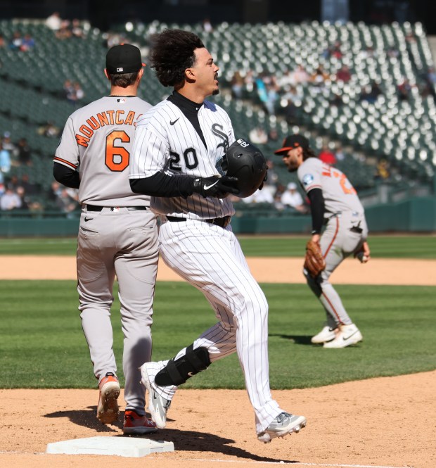 White Sox designated hitter Miguel Vargas reaches for an infield single against the Orioles in the seventh inning at Rate Field on April 8, 2026, in Chicago. (John J. Kim/Chicago Tribune)