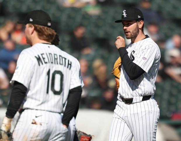 White Sox pitcher Tyler Schweitzer, right, reaches the mound to throw against the Orioles in the eighth inning at Rate Field on April 8, 2026, in Chicago. It was Schweitzer's major-league debut. (John J. Kim/Chicago Tribune)