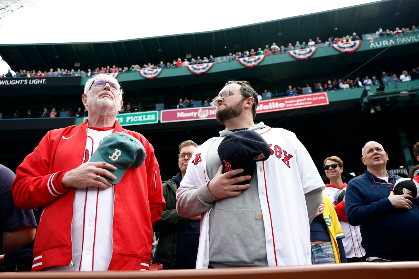 Fans stand for the national anthem.