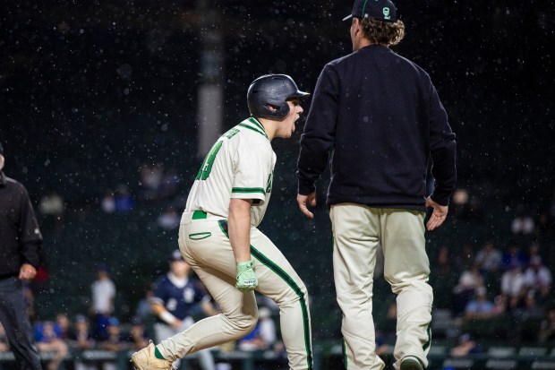 Oak Lawn's Aidan Schopper (19) reacts after a triple against Reavis during nonconference game at Wrigley Field in Chicago on Sunday, April 12, 2026. (Vincent D. Johnson / for the Daily Southtown)