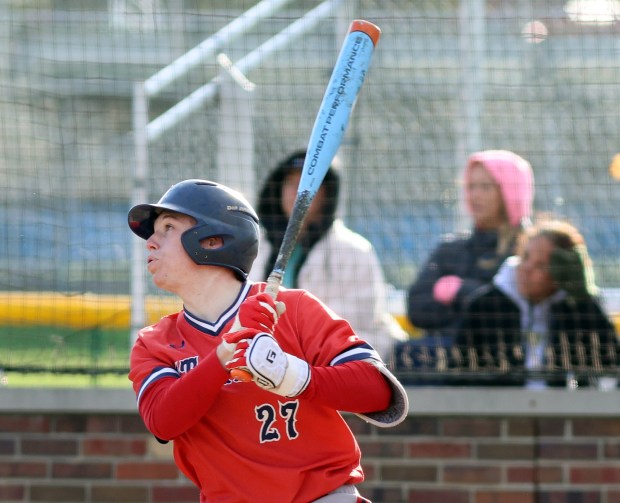 St. Rita's Colin Quinn (27) hits the ball out to center for a single during the game against Oak Forest in Chicago on Monday, April 6, 2026 (James C. Svehla / for Daily Southtown)