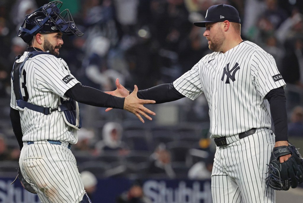 David Bednar celebrates with Austin Wells after closing out the Yankees' 5-3 comeback win over the A's on April 7, 2026 at the Stadium.