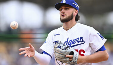 Apr 12, 2026; Los Angeles, California, USA; Los Angeles Dodgers second baseman Alex Freeland (76) tosses the ball to first base to force an out against the Texas Rangers during the fifth inning at Dodger Stadium. Mandatory Credit: Jonathan Hui-Imagn Images