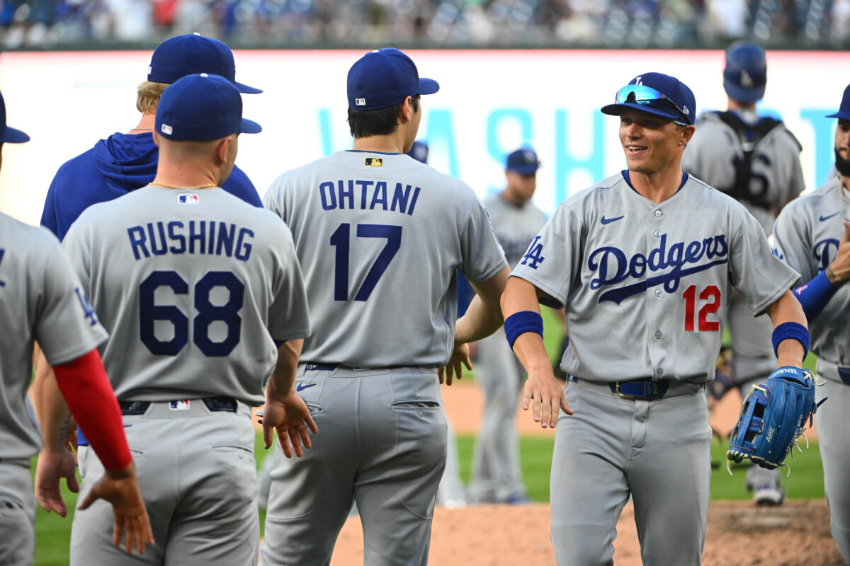 Apr 4, 2026; Washington, District of Columbia, USA; Los Angeles Dodgers left fielder Alex Call (12) and designated hitter Shohei Ohtani (17) react after defeating the Washington Nationals at Nationals Park. Mandatory Credit: Brad Mills-Imagn Images