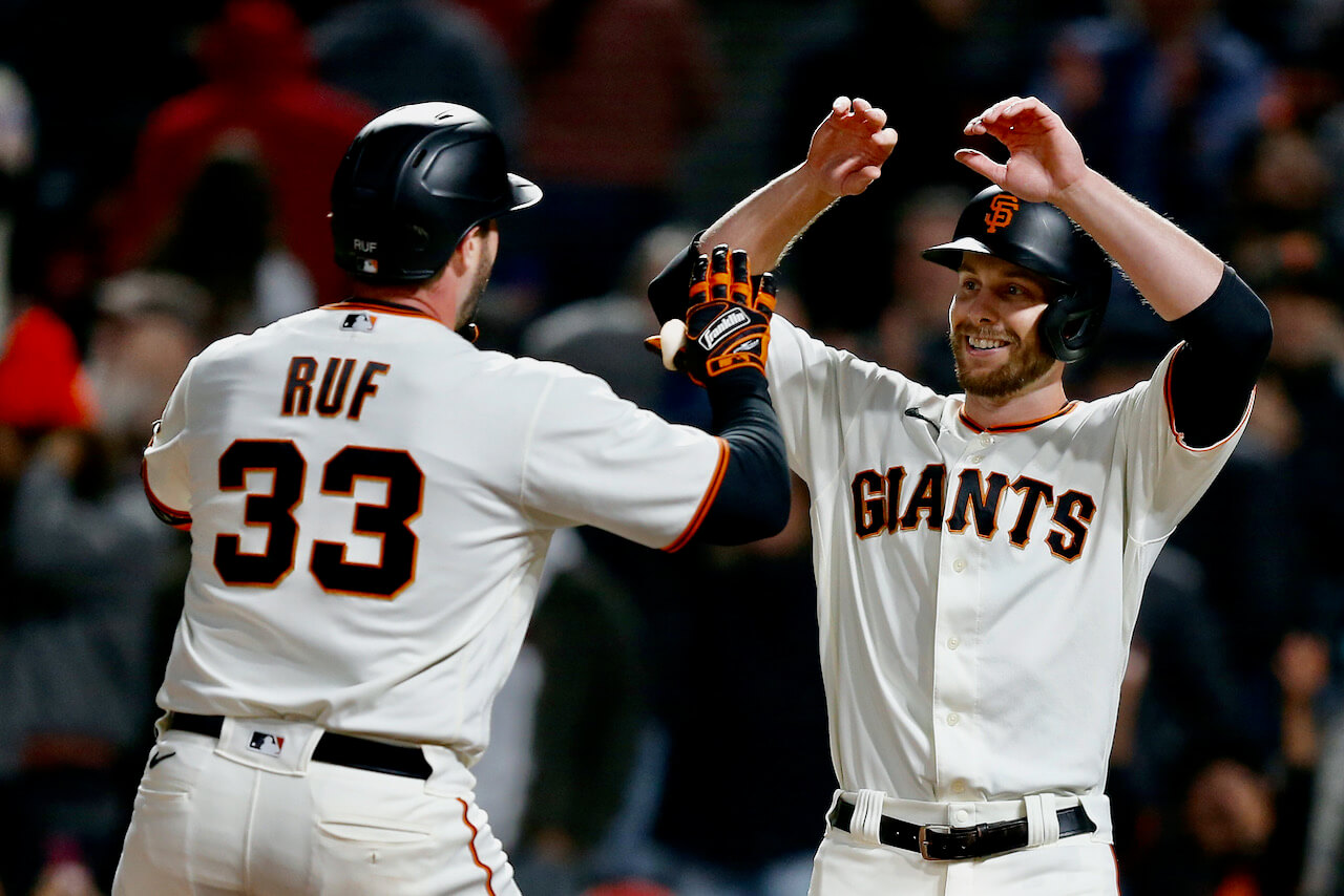 Darin Ruf #33 of the San Francisco Giants celebrates with Austin Slater #13 after hitting a two-run home run in the bottom of the eighth inning against the St. Louis Cardinals at Oracle Park on July 07, 2021.