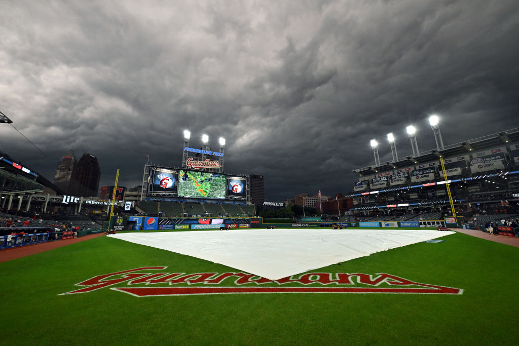 CLEVELAND, OHIO - AUGUST 23: The rain tarp sits on the infield of Progressive Field during the third inning of the game between the Cleveland Guardians and the Los Angeles Dodgers on August 23, 2023 in Cleveland, Ohio. The game was suspended in the third inning. (Photo by Jason Miller/Getty Images)