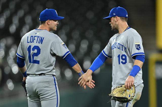 Nick Loftin #12 and Michael Massey #19 of the Kansas City Royals celebrate a 12-1 win against the Chicago White Sox at Rate Field on August 27, 2025 in Chicago, Illinois.