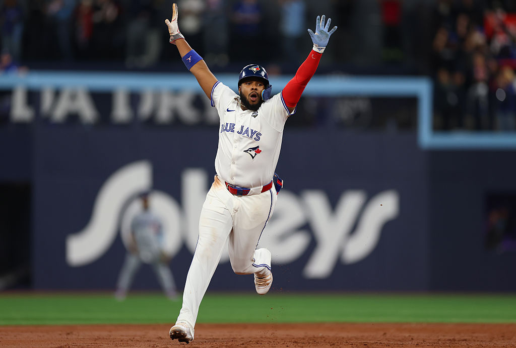 TORONTO, ONTARIO - NOVEMBER 01: Vladimir Guerrero Jr. #27 of the Toronto Blue Jays celebrates after Bo Bichette #11 hits a three-run home run against Shohei Ohtani #17 of the Los Angeles Dodgers during the third inning in game seven of the 2025 World Series at Rogers Center on November 01, 2025 in Toronto, Ontario. (Photo by Gregory Shamus/Getty Images)