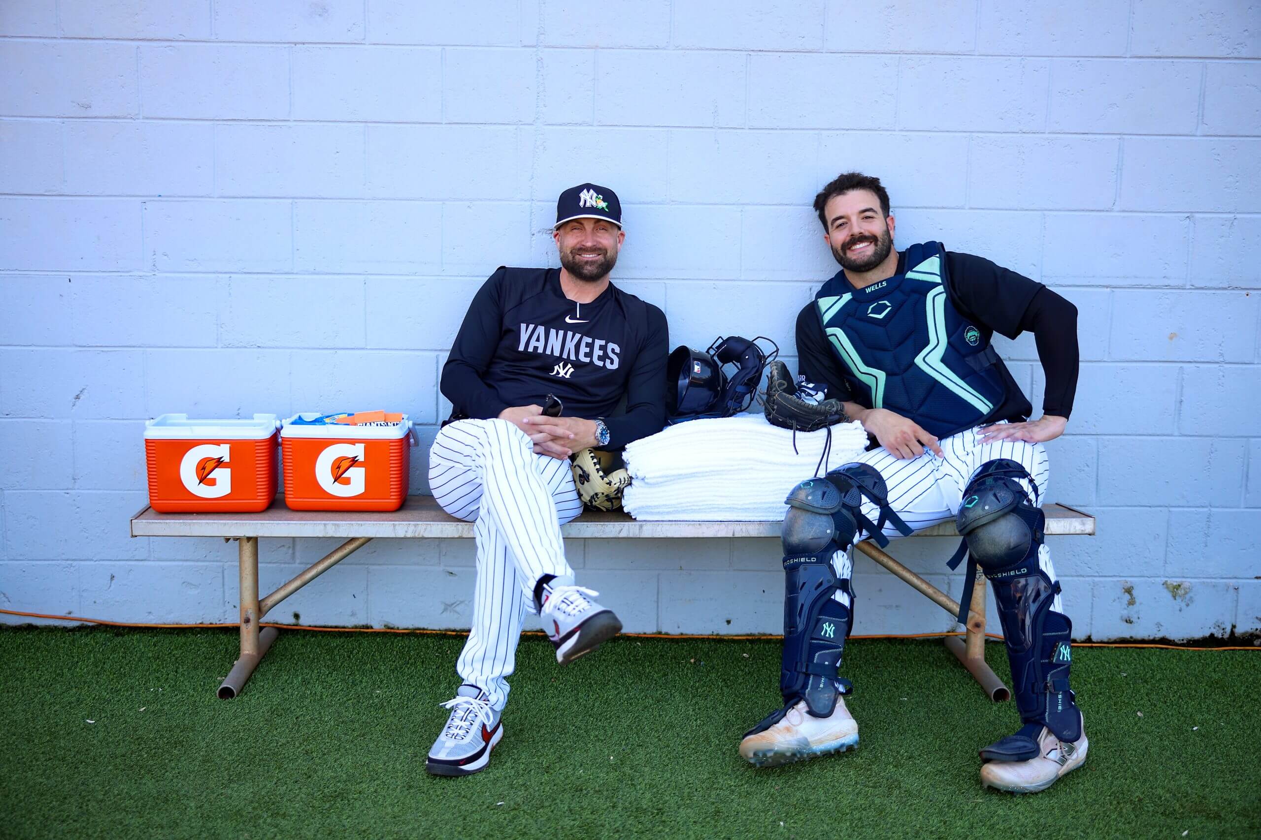 Director of Catching, Tanner Swanson and Austin Wells #28 of the New York Yankees pose for a photo before the spring training game against the Toronto Blue Jays at George M. Steinbrenner Field