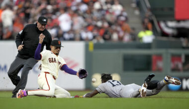 Jazz Chisholm Jr. #13 of the New York Yankees safely steals second base against Willy Adames #2 of the San Francisco Giants during the fifth inning on Opening Day at Oracle Park on March 25, 2026 in San Francisco, California.