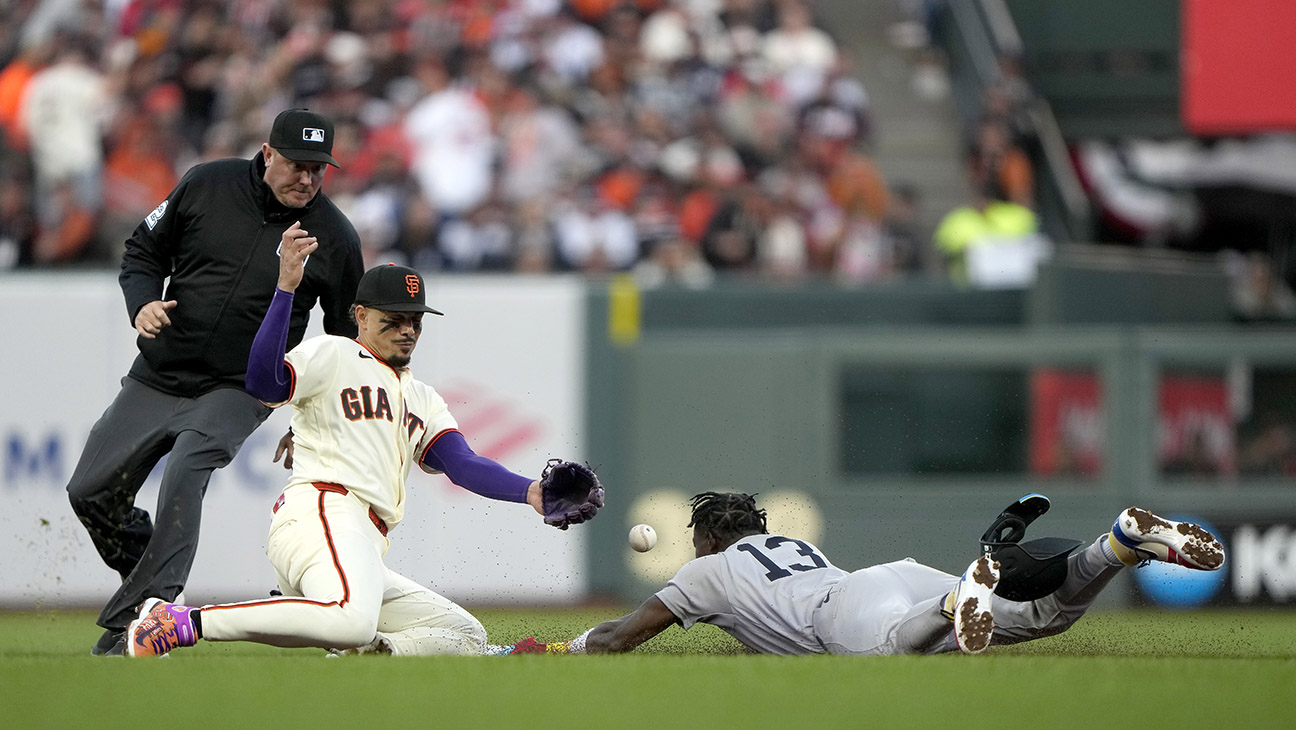 Jazz Chisholm Jr. #13 of the New York Yankees safely steals second base against Willy Adames #2 of the San Francisco Giants during the fifth inning on Opening Day at Oracle Park on March 25, 2026 in San Francisco, California.