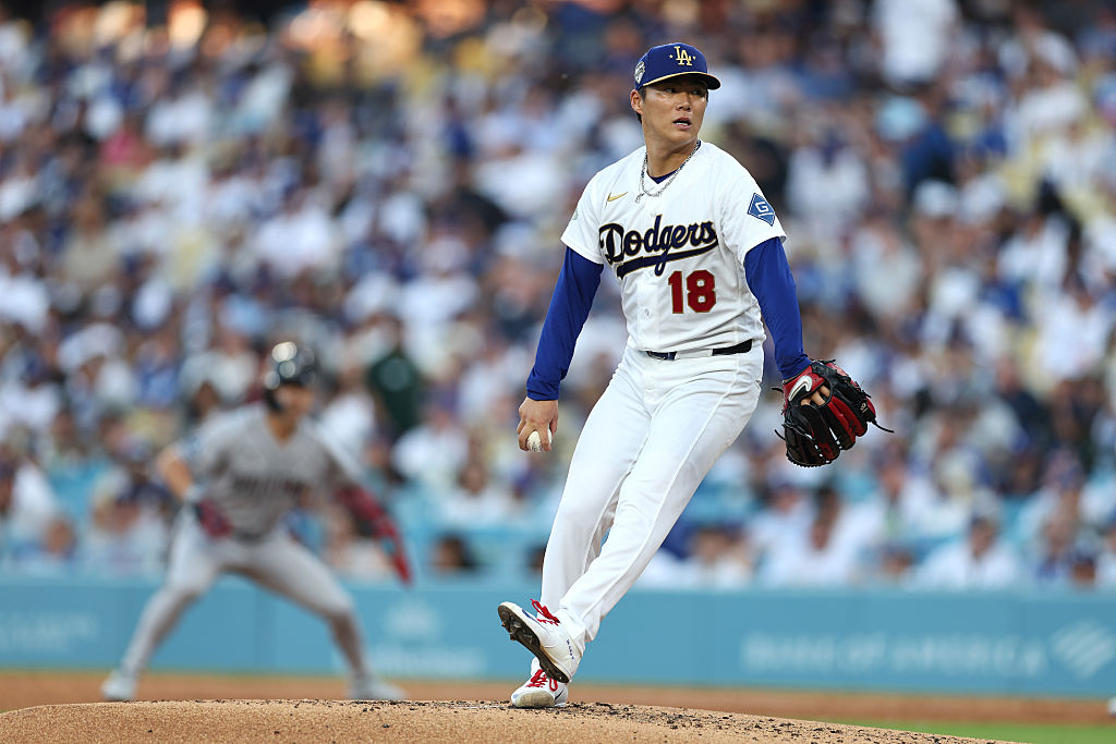 LOS ANGELES, CALIFORNIA - MARCH 26: Yoshinobu Yamamoto #18 of the Los Angeles Dodgers pitches against the Arizona Diamondbacks during the fourth inning during Opening Day at Dodger Stadium on March 26, 2026 in Los Angeles, California. (Photo by Ronald Martinez/Getty Images)