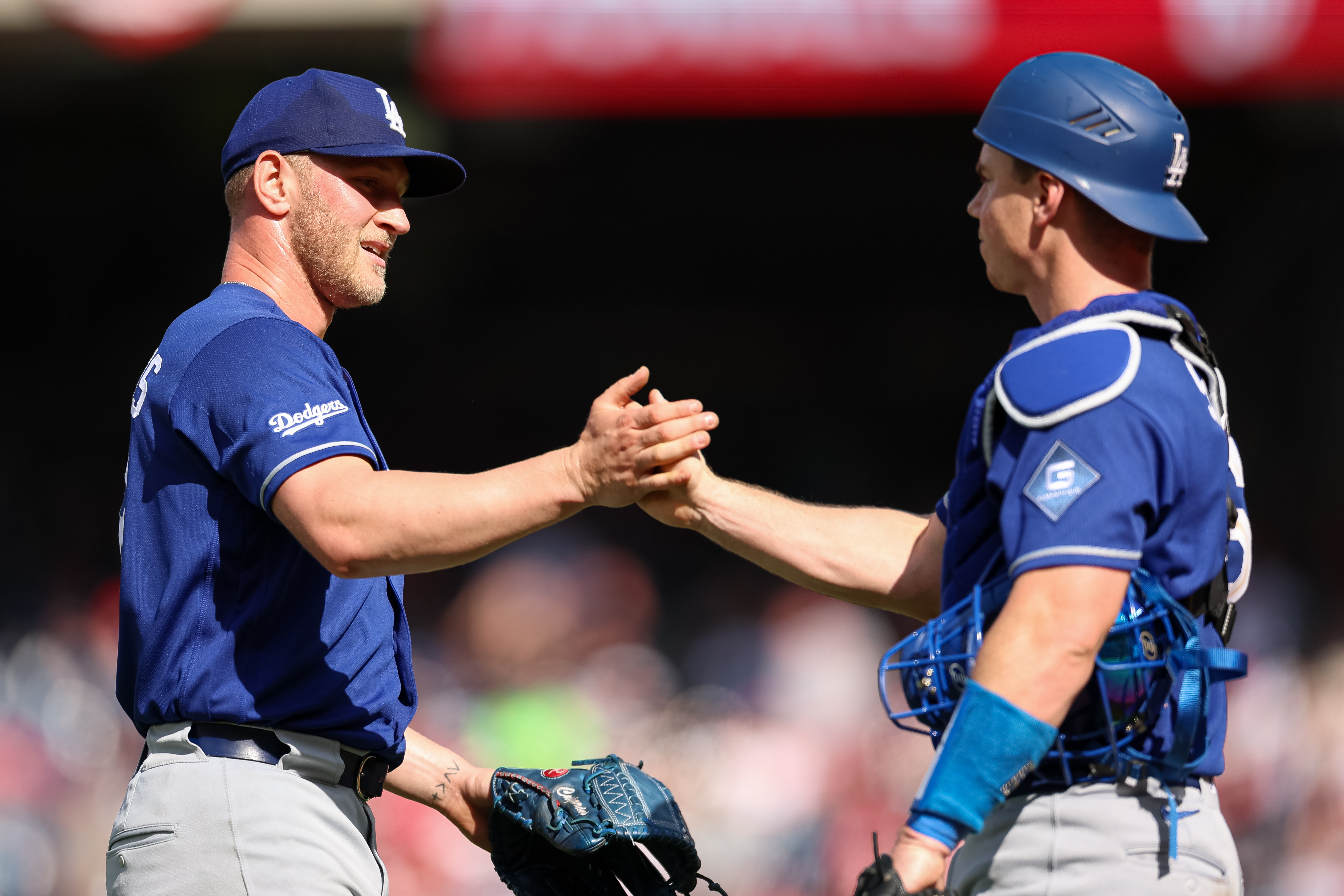 Dodgers relief pitcher Ben Casparius, left, celebrates with catcher Will...