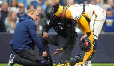 Umpire CB Bucknor leaves game after taking a foul ball off his facemask