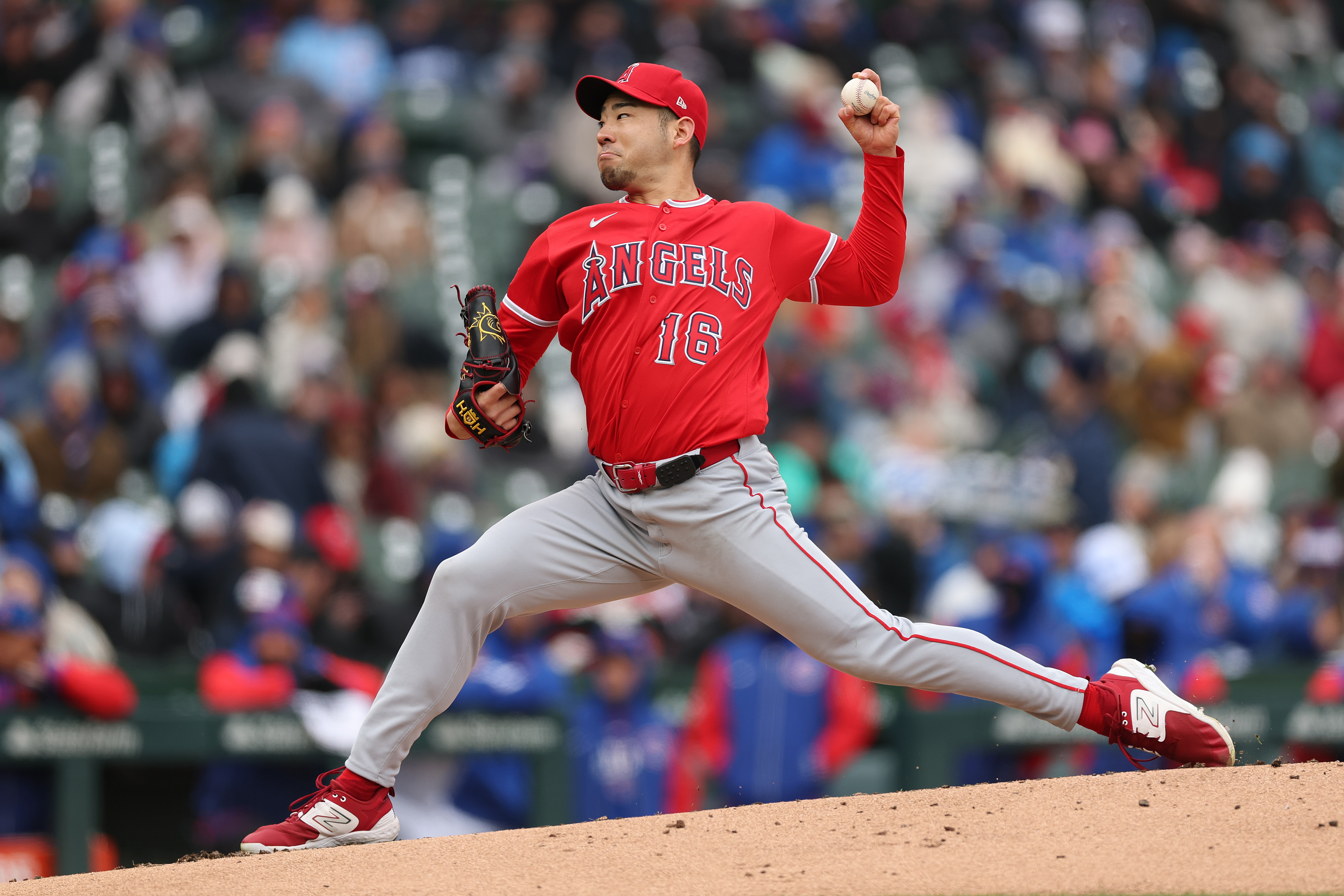 Angels starting pitcher Yusei Kikuchi throws to the plate during...