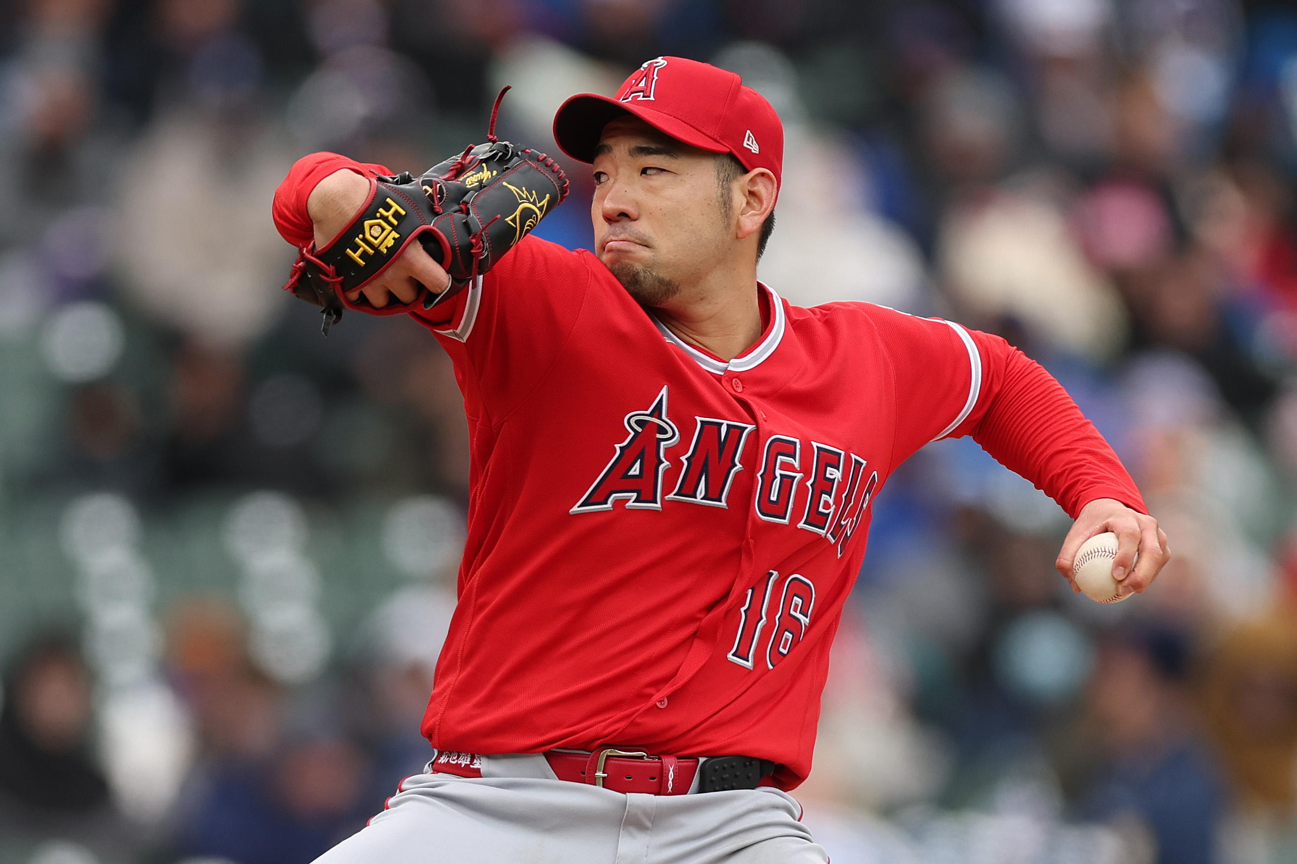 Angels starting pitcher Yusei Kikuchi throws to the plate during...