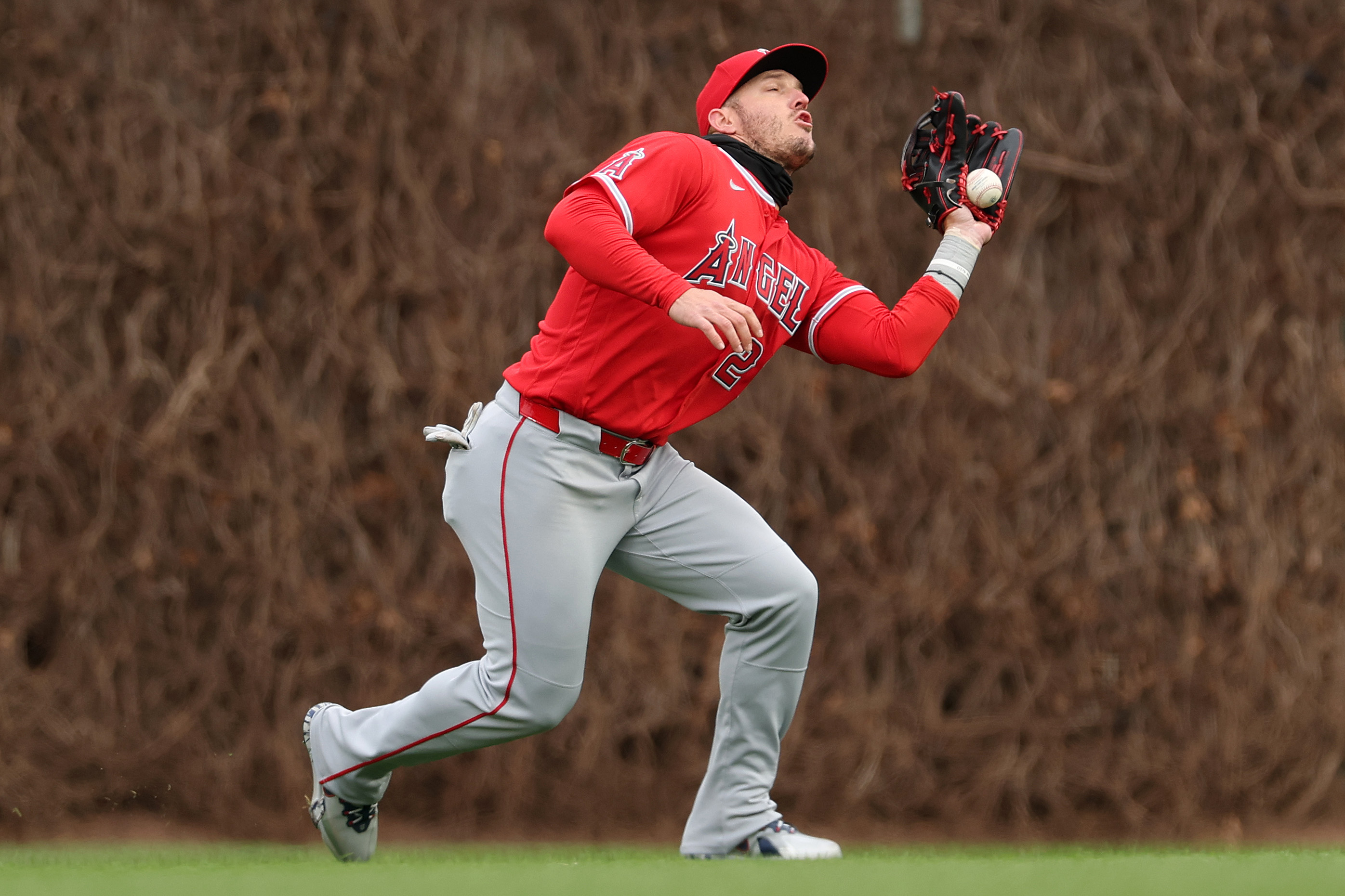 Angels center fielder Mike Trout commits a fielding error during...