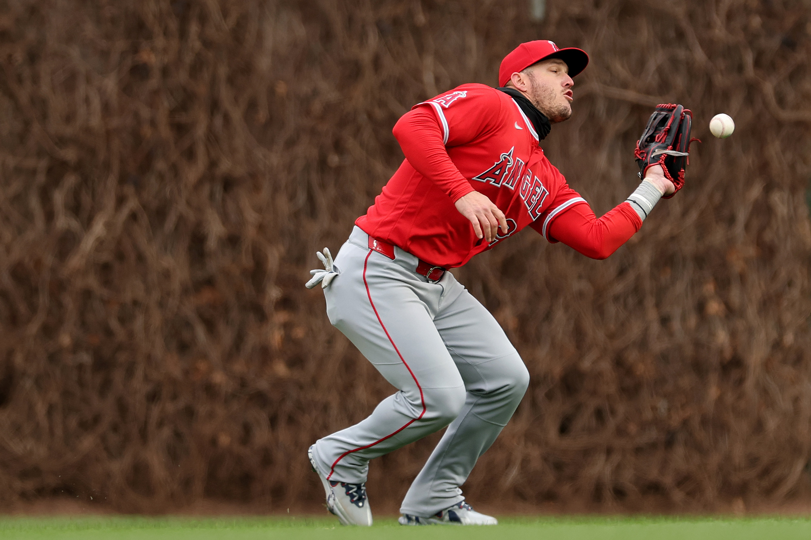 Angels center fielder Mike Trout commits a fielding error during...