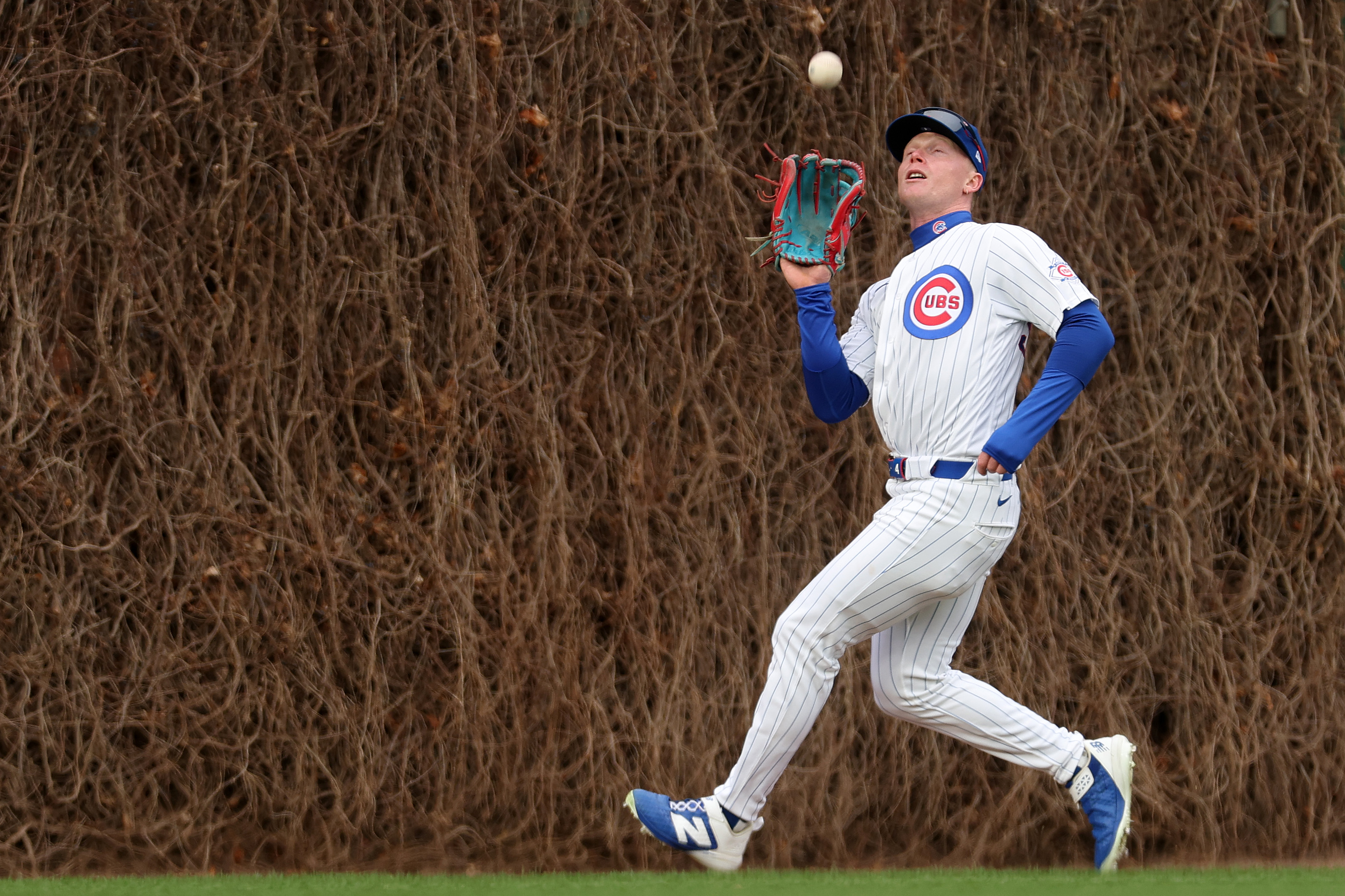 Chicago Cubs center fielder Pete Crow-Armstrong makes a catch during...