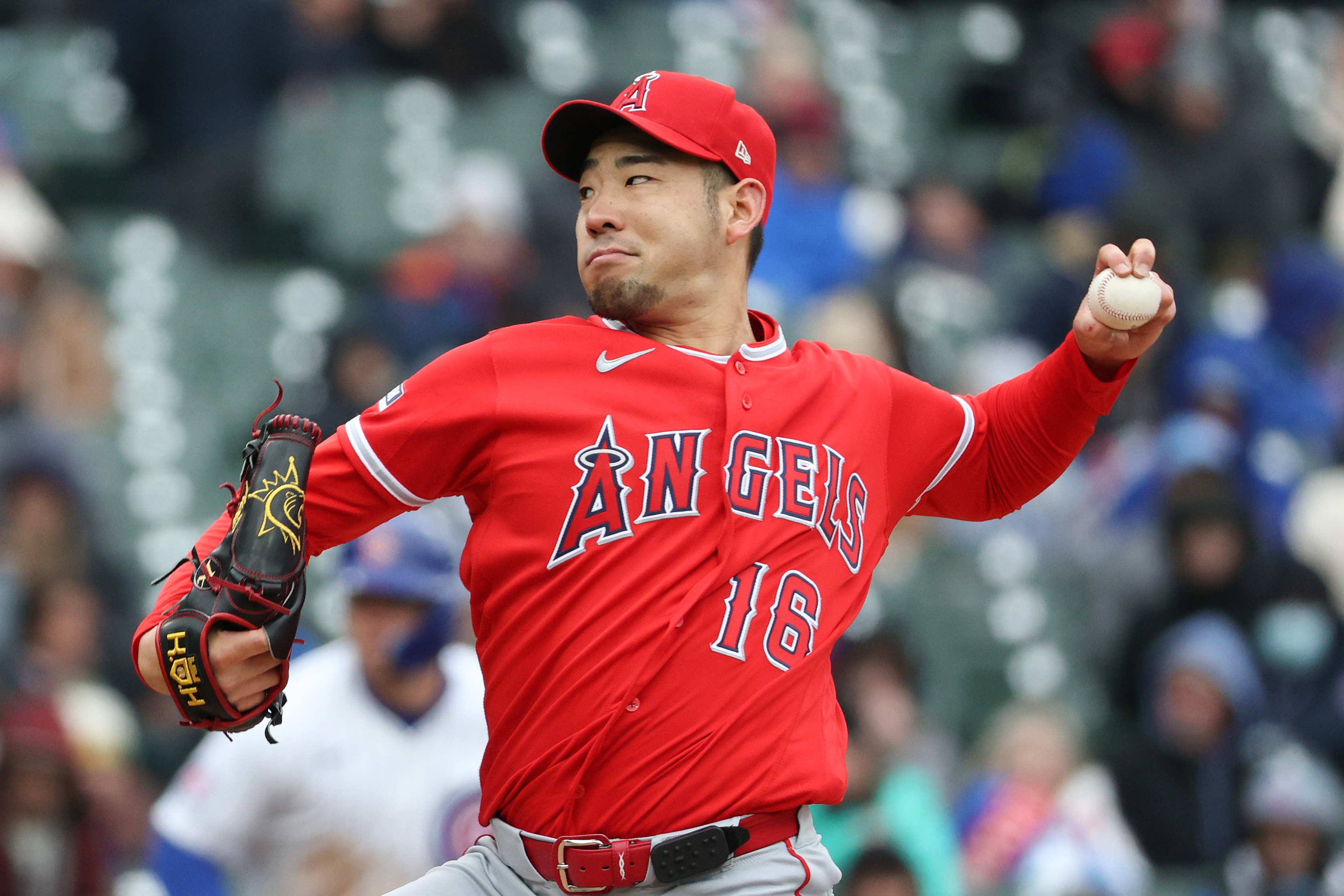 Angels starting pitcher Yusei Kikuchi throws to the plate during...
