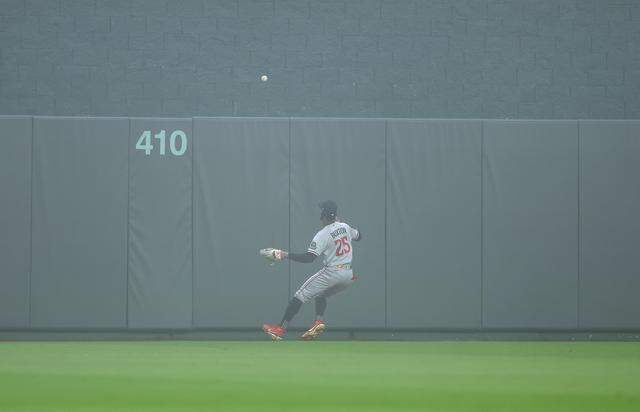 Center fielder Byron Buxton #25 of the Minnesota Twins fields a double off the wall during the 1st inning of the game against the Kansas City Royals at Kauffman Stadium on April 1, 2026 in Kansas City.