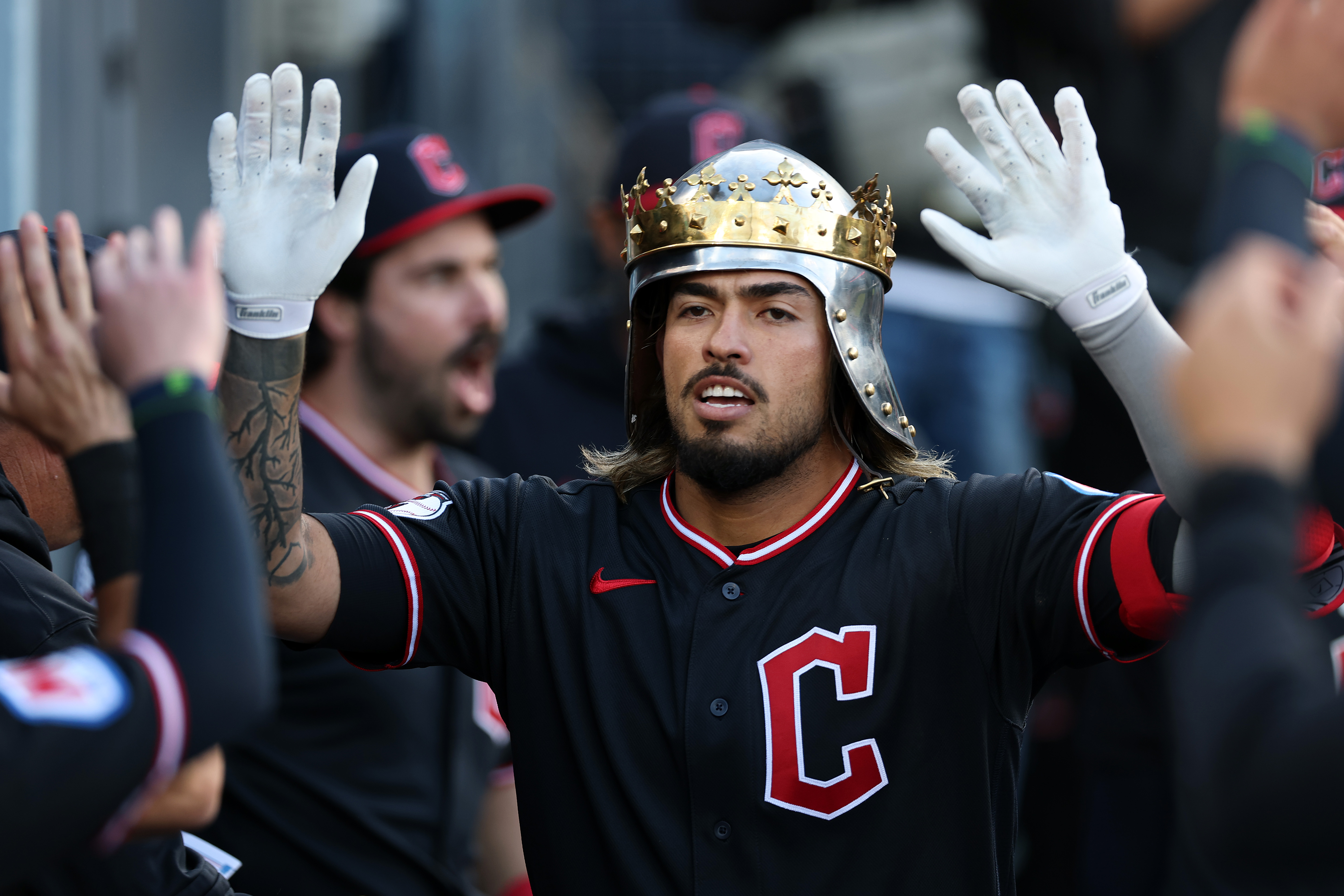 The Cleveland Guardians’ Gabriel Arias celebrates in the dugout after...