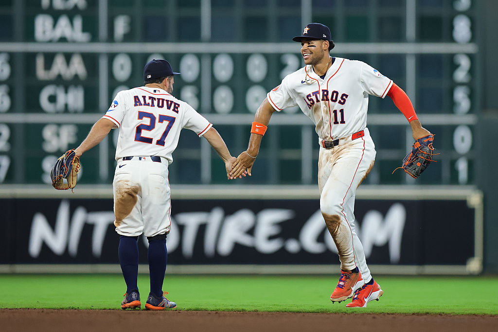 HOUSTON, TEXAS - APRIL 01: Jose Altuve #27 and Cam Smith #11 of the Houston Astros react after a win against the Boston Red Sox at Daikin Park on April 01, 2026 in Houston, Texas. (Photo by Alex Slitz/Getty Images)