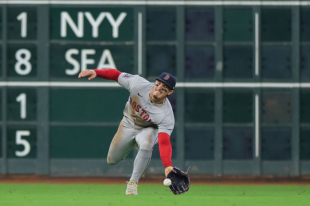 HOUSTON, TEXAS - APRIL 01: Jarren Duran #16 of the Boston Red Sox attempts to catch a ball hit by Yordan Alvarez #44 of the Houston Astros during the third inning at Daikin Park on April 01, 2026 in Houston, Texas. (Photo by Alex Slitz/Getty Images)