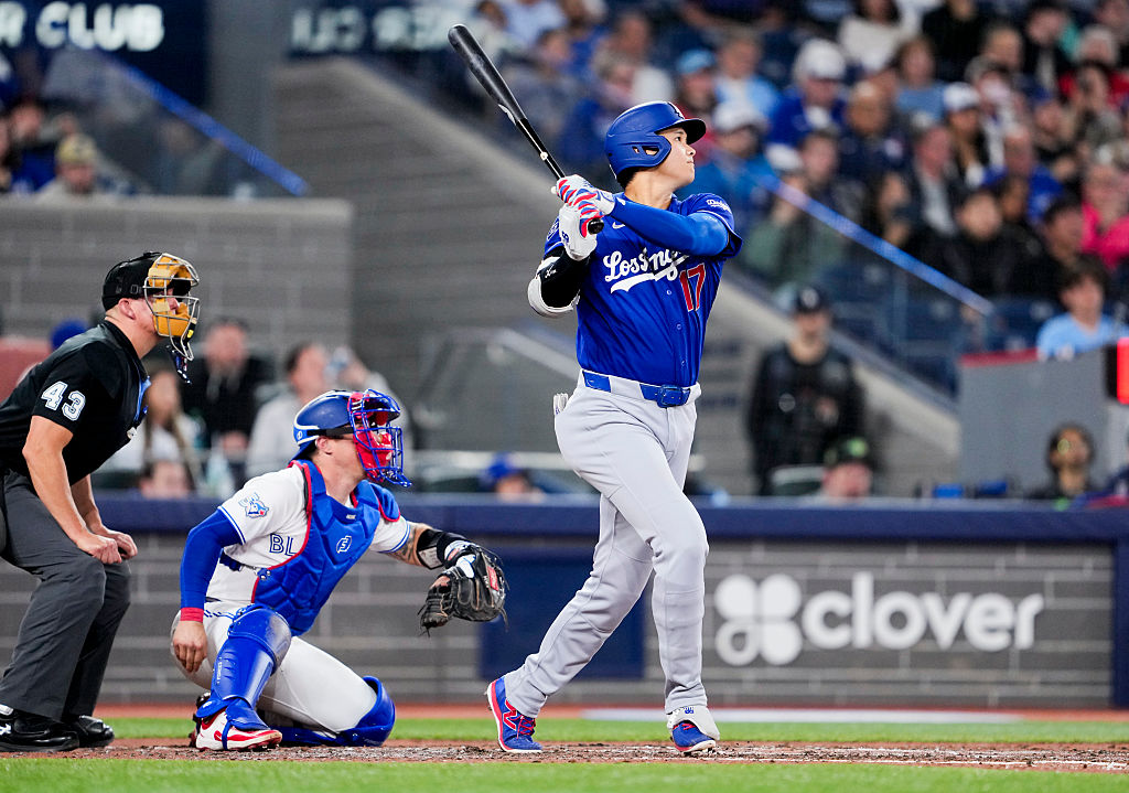 TORONTO, CANADA - APRIL 6: Shohei Ohtani #17 of the Los Angeles Dodgers hits a home run against the Toronto Blue Jays during the sixth inning in their MLB game at the Rogers Centre on April 6, 2026 in Toronto, Ontario, Canada. (Photo by Mark Blinch/Getty Images)