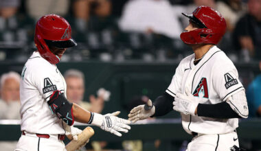 Jordan Lawlar #10 (R) of the Arizona Diamondbacks...