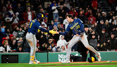 BOSTON, MASSACHUSETTS - APRIL 06: Jake Bauers #9 of the Milwaukee Brewers greets Christian Yelich #22 at home after Yelich scored in the eighth inning against the Boston Red Sox at Fenway Park on April 06, 2026 in Boston, Massachusetts. (Photo by Jaiden Tripi/Getty Images)