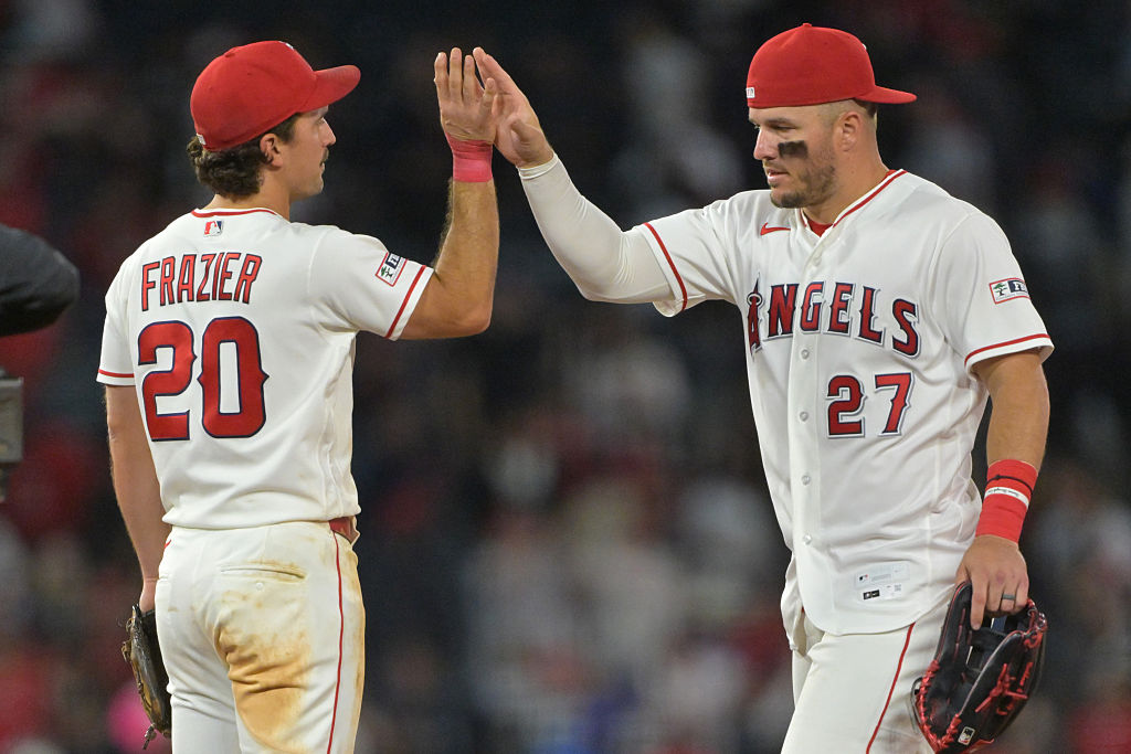 ANAHEIM, CALIFORNIA - APRIL 17: Adam Frazier #20 of the Los Angeles Angels congratulates Mike Trout #27 after the final out of the ninth inning against the San Diego Padres at Angel Stadium of Anaheim on April 17, 2026 in Anaheim, California.