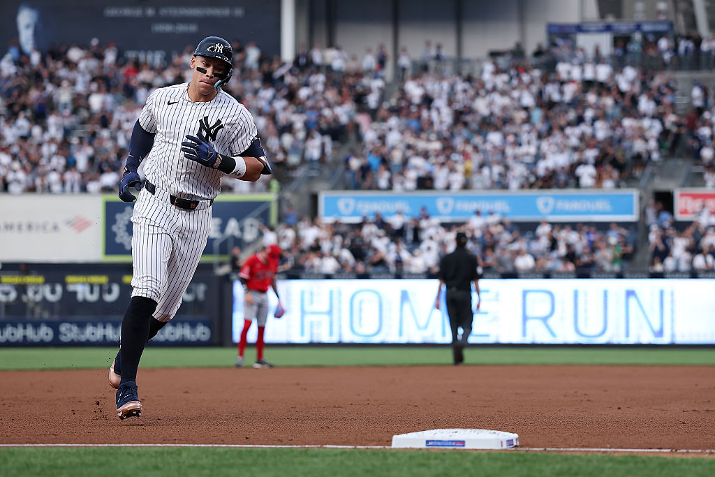 NEW YORK, NEW YORK - APRIL 15: Aaron Judge #99 of the New York Yankees rounds the bases after hitting a solo home run during the first inning of the game against the Los Angeles Angels at Yankee Stadium on April 15, 2026 in New York City. All players are wearing the number 42 in honor of Jackie Robinson Day. (Photo by Dustin Satloff/Getty Images)