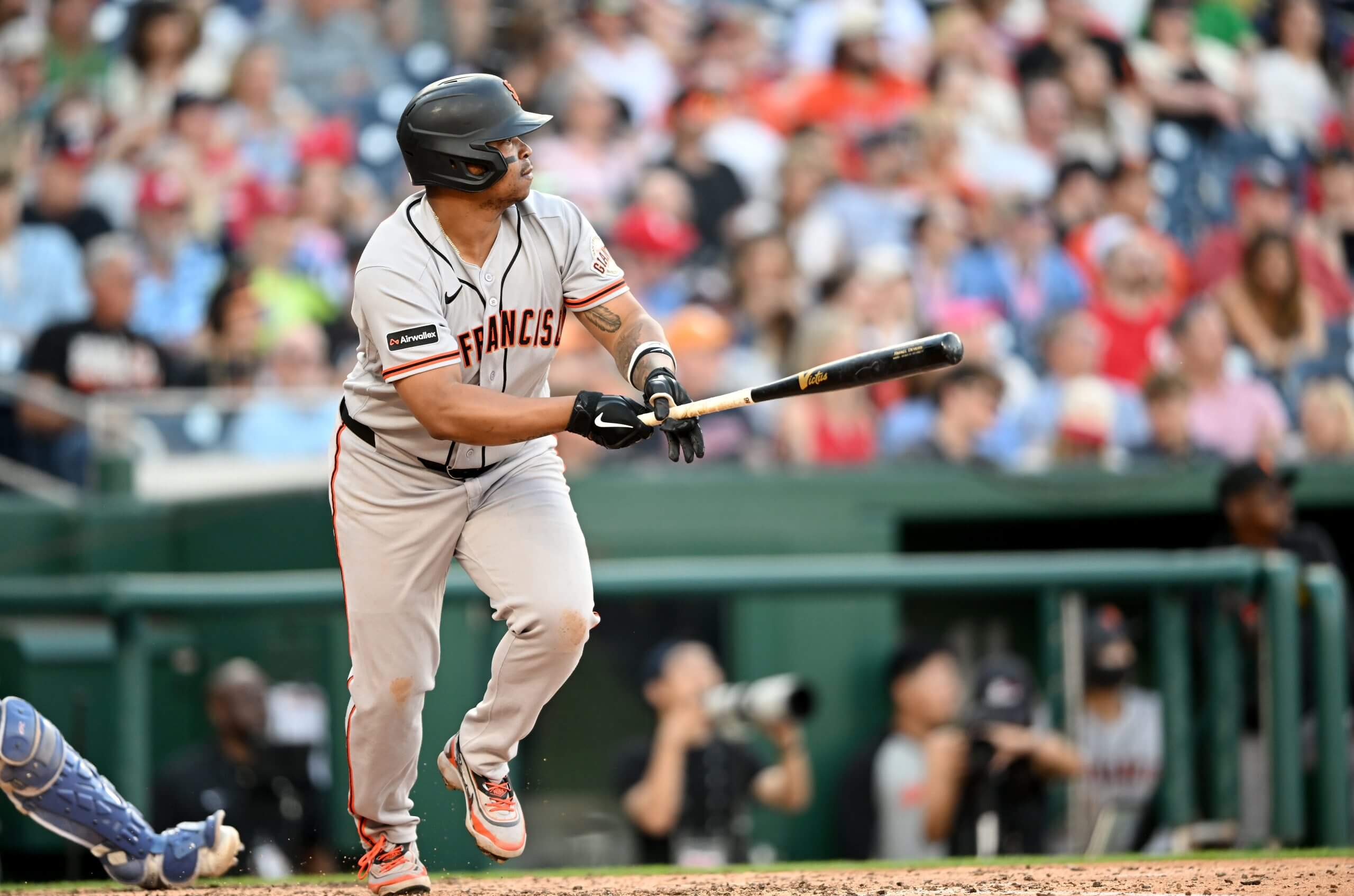 Rafael Devers #16 of the San Francisco Giants drives in a run with a single in the seventh inning against the Washington Nationals at Nationals Park on April 18, 2026 in Washington, DC. 
