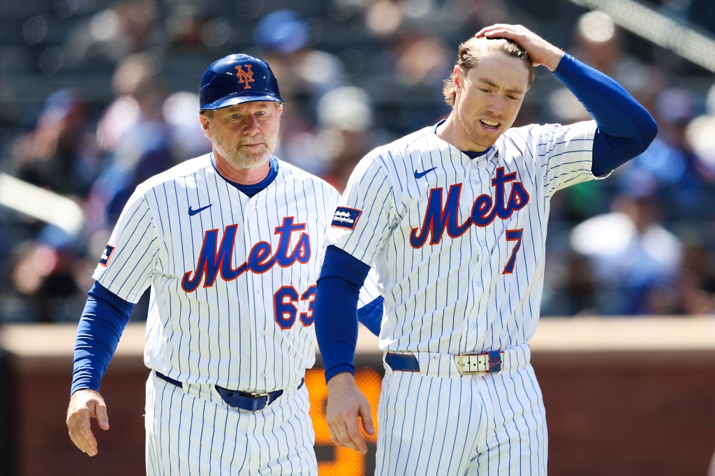 Mets third baseman Brett Baty (7) is separated from the home plate umpire by coach Tim Leiper (63) after striking out during a loss to the Rockies in Game 1 of a doubleheader on April 26, 2026.