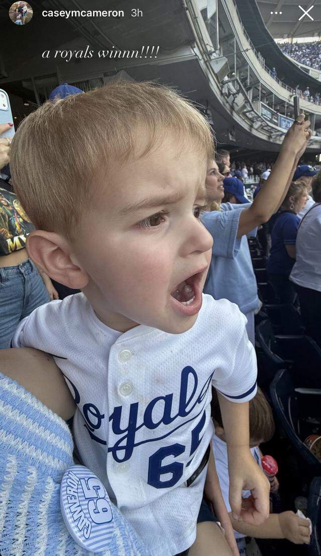 Auggie Cameron, son of Royals pitcher Noah Cameron, celebrated the team’s opening day win Monday with his mom, Casey Cameron.