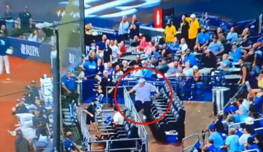 Hilarious moment MLB fan's pants fall down as he tumbles over while chasing foul ball at Cubs-Rays